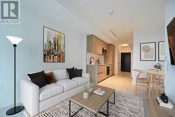 Toronto (Mount Pleasant West) condo for rent - A living room with a white couch and a coffee table.
