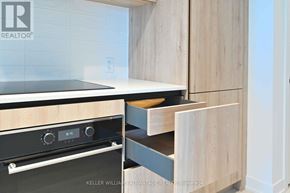 Toronto (Mount Pleasant West) condo for rent - A modern kitchen with a stove and a drawer in the cabinet.