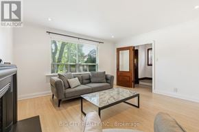 Toronto (Leaside) apartment for rent - A living room with a grey couch and a glass coffee table.