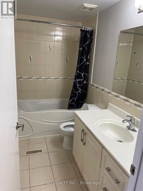 Markham (Middlefield) apartment for rent - A bathroom with a white tub, sink, and toilet.