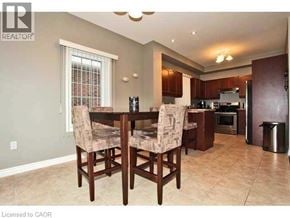 Ancaster townhouse for rent - A dining room with a table and chairs.