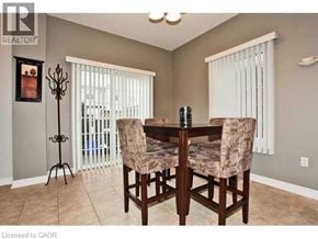 Ancaster townhouse for rent - A dining room with a table and chairs.