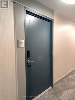 Mississauga (Hurontario) condo for rent - A door with a sign on it that says "STORIES 217".