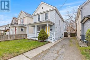 Welland (Broadway) apartment for rent - A house with a yellow door is for sale.