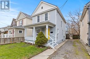 Welland (Broadway) apartment for rent - A house with a white front porch and a yellow door.