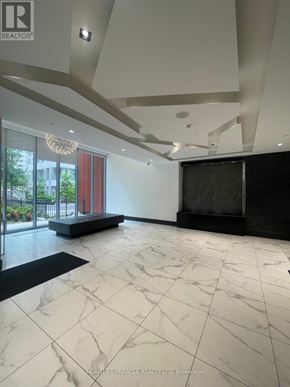 Toronto (Mount Pleasant East) condo for rent - A spacious room with marble flooring and a chandelier.
