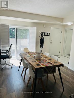 Toronto (Rouge) townhouse for rent - A dining room with a table set for four.