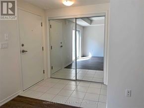 Toronto (Rouge) townhouse for rent - A white door with a glass panel is open to a hallway.