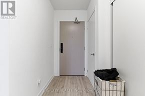 Burlington (Alton) condo for rent - A hallway with a door and a trash can.