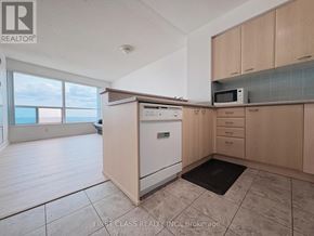 Toronto (Woburn) condo for rent - A kitchen with a dishwasher, microwave, and oven.