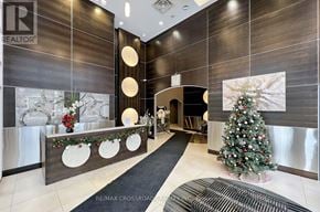 Toronto (Bendale) condo for rent - A Christmas tree is decorated with red ornaments and white lights.