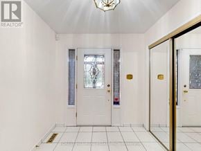 Markham (Unionville) apartment for rent - A white door with a glass window and a gold handle.