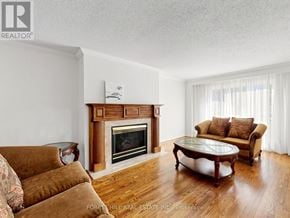 Markham (Unionville) apartment for rent - A living room with a fireplace and a couch.