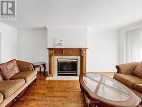 Markham (Unionville) apartment for rent - A living room with a fireplace and a couch.