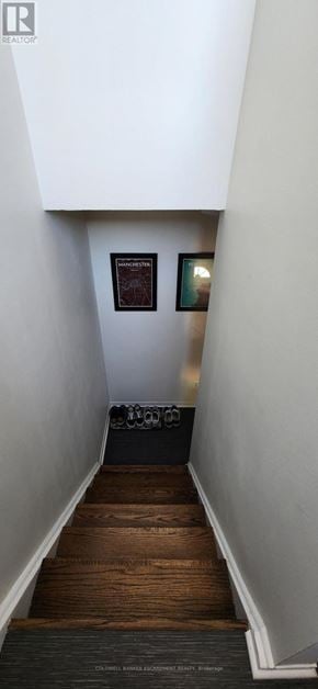 Halton Hills (Georgetown) townhouse for rent - A staircase with a black carpeted bottom step.
