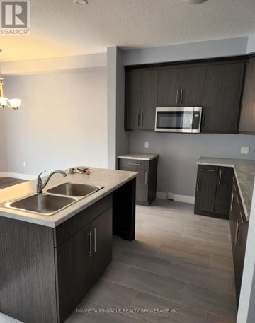 London South (South U) apartment for rent - A kitchen with a sink and a microwave.