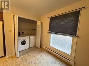 Kawartha Lakes (Bobcaygeon) multi-family for rent - A laundry room with a washer and dryer in it.