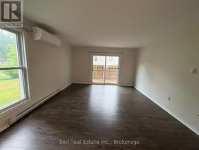 Kawartha Lakes (Bobcaygeon) multi-family for rent - A room with a sliding door leading to a balcony.