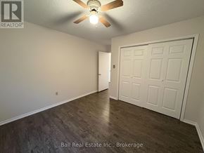 Kawartha Lakes (Bobcaygeon) multi-family for rent - A room with a ceiling fan and a white door.