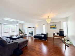 Surrey apartment for rent - A living room with a fireplace and a painting on the wall.