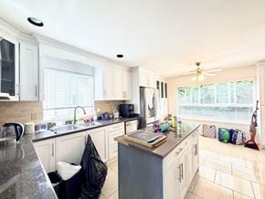 Surrey apartment for rent - A kitchen with a black bag on the counter.