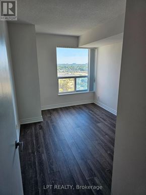 Toronto (Woburn) condo for rent - A room with a view of the city through a window.