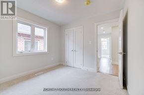 Vaughan (West Woodbridge) apartment for rent - A white bedroom with a window and a door.