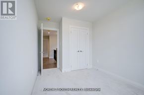 Vaughan (West Woodbridge) apartment for rent - A white room with a door and a window.