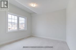 Vaughan (West Woodbridge) apartment for rent - A white room with a window and a sign that says "NORTH 2 SOUTH REALTY Brokerage".