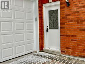 Richmond Hill (Bayview Hill) apartment for rent - A white door with a glass window is on a red brick wall.