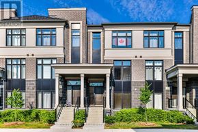 Markham (Wismer) townhouse for rent - A row of townhouses with a clear blue sky above them.