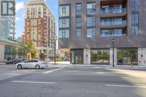 Burlington (Brant) condo for rent - A car is parked on the street in front of a Royal Canadian Realty Brokerage building.