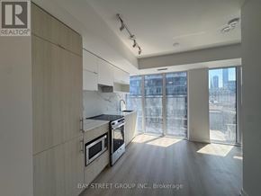 Toronto (Church-Yonge Corridor) condo for rent - A modern kitchen with a view of the city.