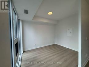Toronto (Church-Yonge Corridor) condo for rent - A room with a window and a door with a sign that says Bay Street Group Inc Brokerage.