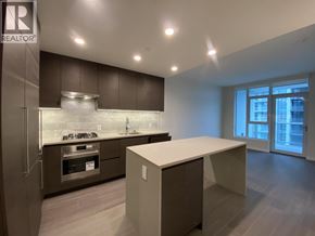 Burnaby apartment for rent - A modern kitchen with a large island and stainless steel appliances.
