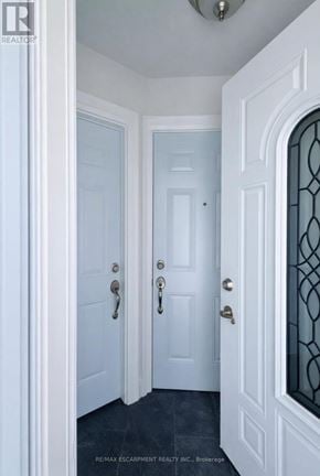 Brantford apartment for rent - A hallway with two doors and a window.
