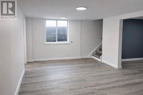 Brantford apartment for rent - A room with a window and wooden flooring.