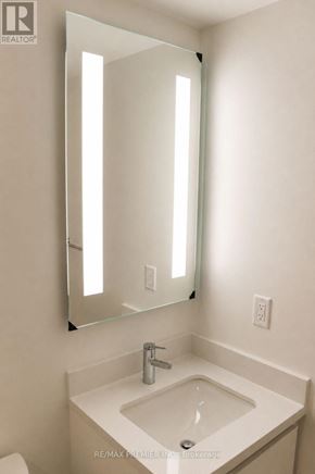 Mississauga (City Centre) condo for rent - A white sink under a mirror in a bathroom.