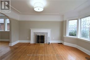 Hamilton (Delta) apartment for rent - A living room with a fireplace and wood flooring.
