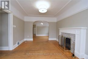 Hamilton (Delta) apartment for rent - A room with a fireplace and a wooden floor.