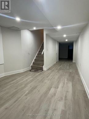 Brampton (Northwest Brampton) apartment for rent - A hallway with a staircase and light wood flooring.