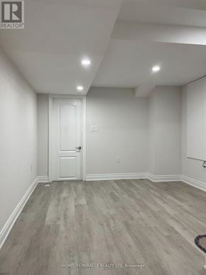 Brampton (Northwest Brampton) apartment for rent - A room with a white door and a wooden floor.