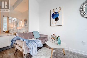 Toronto (Church-Yonge Corridor) condo for rent - A living room with a couch, a table, and a painting on the wall.