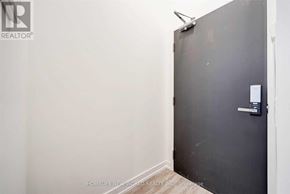 Toronto (Church-Yonge Corridor) condo for rent - A room with a closed door and a wall-mounted light fixture.