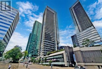 Toronto (Willowdale East) condo for rent - A cityscape with tall buildings and a clear sky.