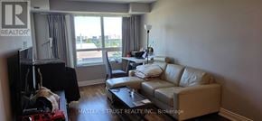 Markham (Unionville) condo for rent - A living room with a couch, chair, and a coffee table.