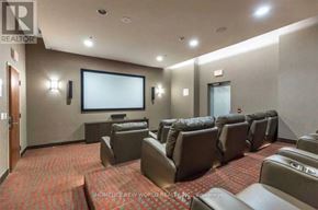 Toronto (Bendale) condo for rent - A home theater room with a row of seats and a large screen.