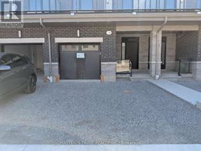 Richmond Hill townhouse for rent - A car is parked in front of a garage door.