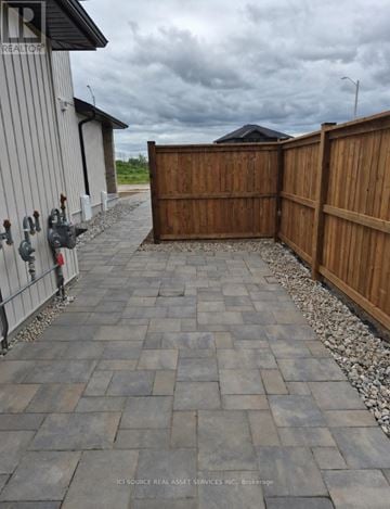 Belleville (Belleville Ward) apartment for rent - A grey stone pathway leads to a wooden gate.
