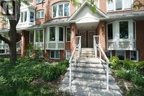 Ottawa townhouse for rent - A house with a red brick facade and white trim.